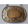 A Vintage Silver Plated `WINE` Bottle Decanter Label By `Ianthe, England`. (1 of 2).
