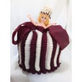 Vintage knitted doll tea cosy
