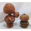 Kokeshi doll family signed by artist