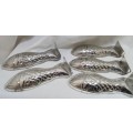 Ten vintage small fish moulds