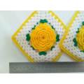 Kitsch is king! Crocheted potholders with beautiful yellow flowers.