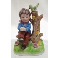 Lovely vintage boy on tree stump figurine in perfect condition