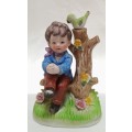 Lovely vintage boy on tree stump figurine in perfect condition