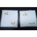 Two lovely small embroidered square doilies