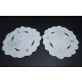 Two lovely small embroidered cutwork doilies