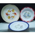 Three vintage enamel plates