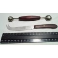 Two vintage utensils - cheese knife and melon baller