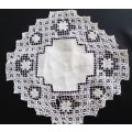 Very interesting crocheted white doily
