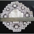 Very interesting crocheted white doily