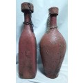 Two beautiful vintage leather clad wine bottles