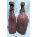 Two beautiful vintage leather clad wine bottles