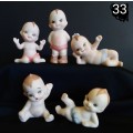 Beautiful set of 5 hand painted porcelain kewpies