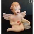 Beautiful  hand painted porcelain Angel with blue books