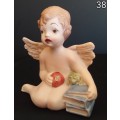 Beautiful  hand painted porcelain Angel with blue books