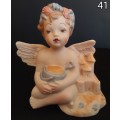 Beautiful  hand painted porcelain Angel with blue beach bucket