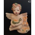Beautiful  hand painted porcelain Angel with green beach bucket