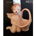 Beautiful hand painted porcelain Angel with basket