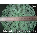Magnificent detailed green crocheted doily - about 23cms across