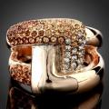 Paparazzi has on offer an Impressive Topaz & Swarovski BUCKLE RING -  Gold Plated - #8