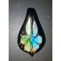 Paparazzi has on offer an Incredible HANDMADE LAMP WORK GLASS Flower Pendant - 2"
