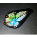 Paparazzi has on offer an Incredible HANDMADE LAMP WORK GLASS Flower Pendant - 2"