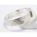 A Gorgeous Weighty Textured Hinged Bangle in Sterling Silver.