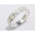 A Gorgeous Weighty Textured Hinged Bangle in Sterling Silver.