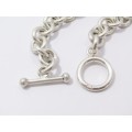 A Lovely Weighty Bracelet Made up in Circles With a Fob Clasp in Sterling Silver.