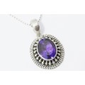 A Gorgeous Oval Amethyst Pendant On Chain in Sterling Silver.