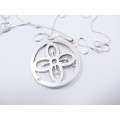 A Lovely Round Cut Out Flower Pendant on Chain in Sterling Silver.