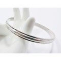 A Gorgeous Solid Ribbed Design Bangle in Sterling Silver.