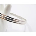 A Gorgeous Solid Ribbed Design Bangle in Sterling Silver.