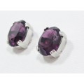 A Gorgeous Pair of Purple Zirconia Stud Earrings in Sterling Silver.