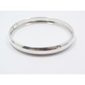 A Lovely Broad D Shape Bangle in Sterling Silver.