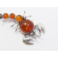 An Amazing Amber Scorpion Brooch in Sterling Silver.