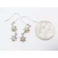 A Lovely Pair of Champagne Color Zirconia Flower Drop Earrings in Sterling Silver