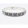 A Stunning Weighty Articulated Engraved  Lapis Lazuli paneled Bracelet in Sterling Silver