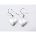 A Lovely Pair of Heart Dangling Earrings in Sterling Silver.