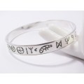 A Stunning Rustic Runic Design Bangle in Sterling Silver.
