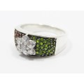A Stunning Flower Design  Ring Encrusted With Garnets And Peridots in Sterling Silver
