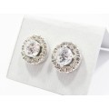 A Lovely Pair of Halo Design Zirconia Stud Earrings in Sterling Silver