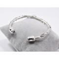 A Gorgeous Bespoke Cuff Bangle Depicting Two Stems of Roses in Sterling Silver