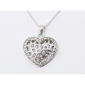 A Stunning Medium Size Heart Pendant Surrounded With Tiny Zirconia`s on Chain in Sterling Silver.