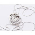 A Stunning Medium Size Heart Pendant Surrounded With Tiny Zirconia`s on Chain in Sterling Silver.