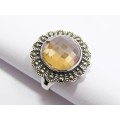 A Lovely Faceted  Peach Color Zirconia Ring Surrounded With Marcasite`s  in Sterling Silver