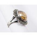 A Lovely Faceted  Peach Color Zirconia Ring Surrounded With Marcasite`s  in Sterling Silver