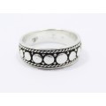 A Lovely Patterned Design Band in Sterling Silver.