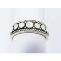 A Lovely Patterned Design Band in Sterling Silver.
