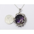 A Stunning Large Purple Zirconia Pendant With Marcasite`s on Chain in Sterling Silver.