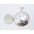 A Gorgeous Domed Vintage Design Locket On Chain in Sterling Silver.